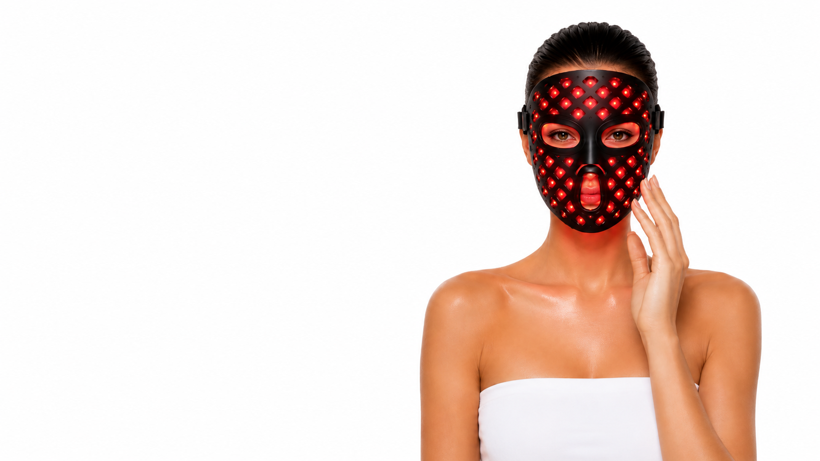 Woman wearing a black red light LED facial mask for non-invasive CELONIQUE skincare treatment on a clean white background.