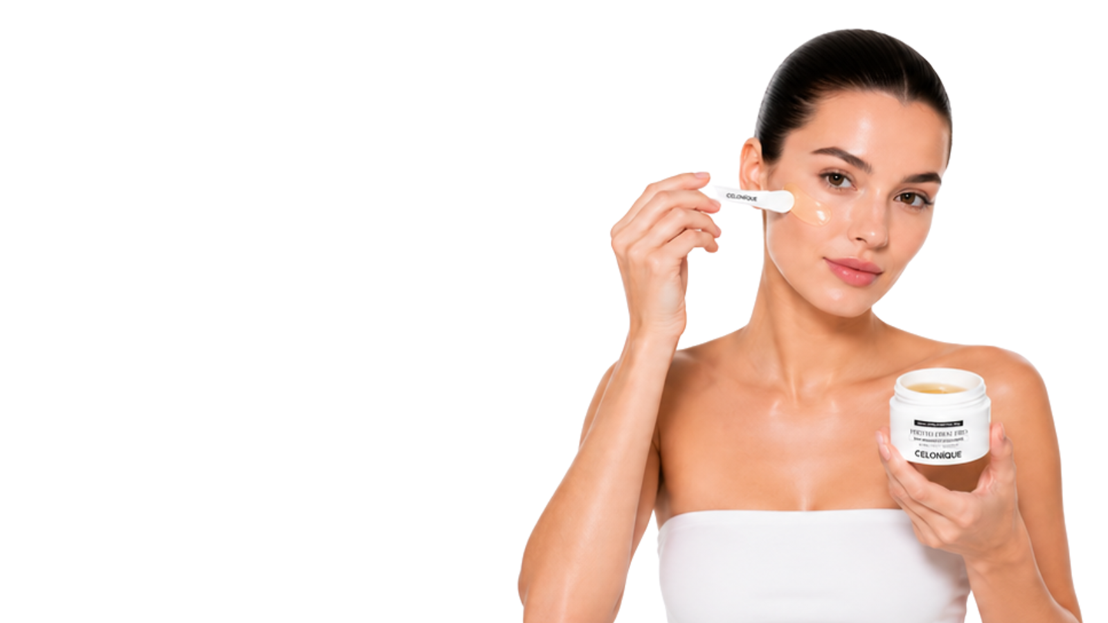 Woman applying CELONIQUE Photo Firm Pro skincare gel with an applicator while holding the open product jar on a clean white background.